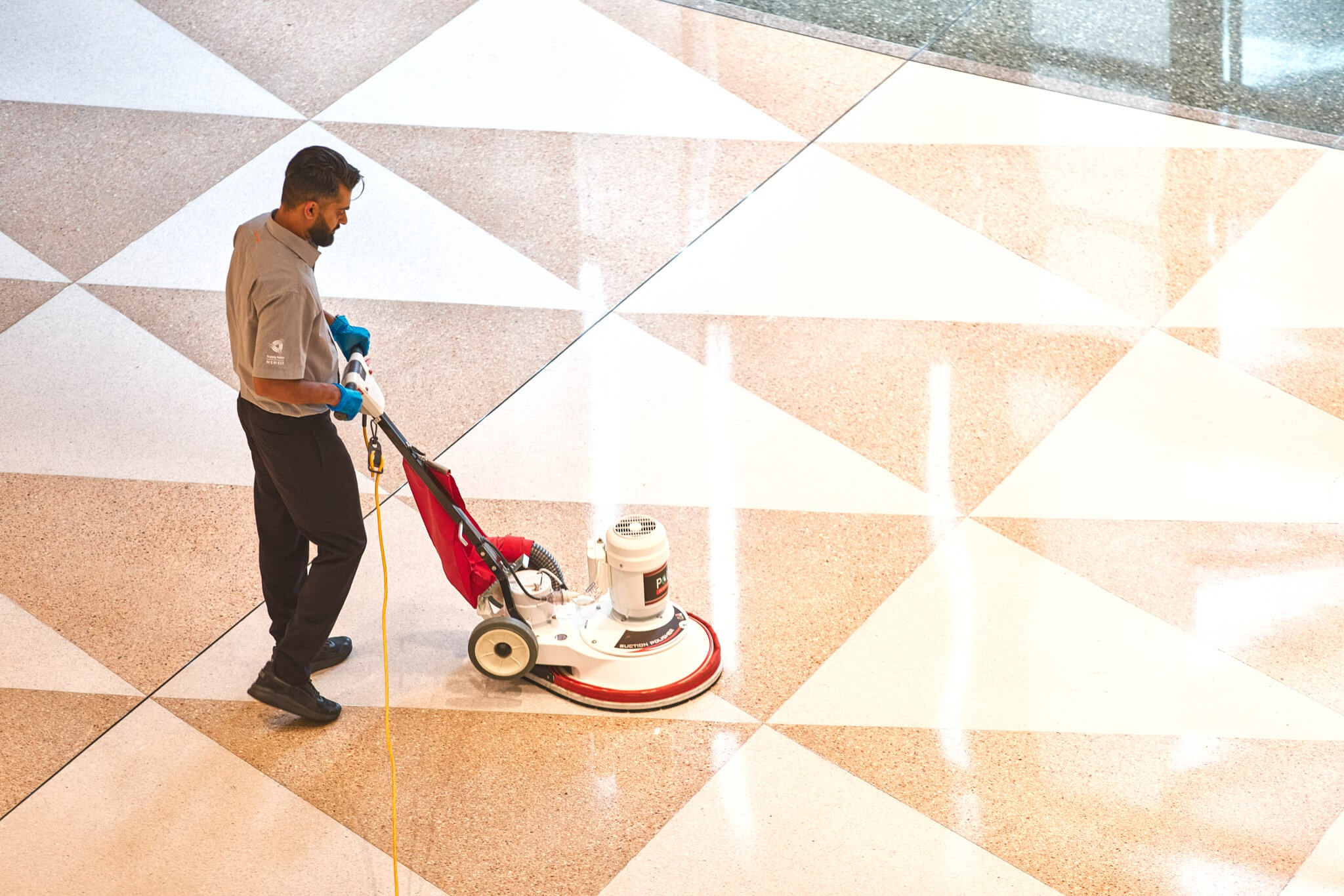 Worker polishing a workplace floor